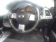 Nissan_Marano_2005_Black_steeringwheel_dashboard_gear.JPG